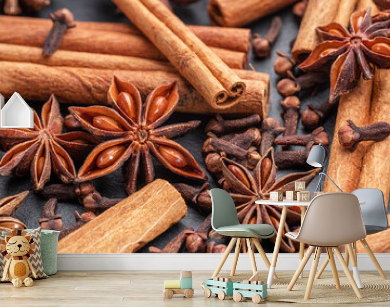Lots of three spices for mulled wine – star anise, cinnamon and clove, macro.