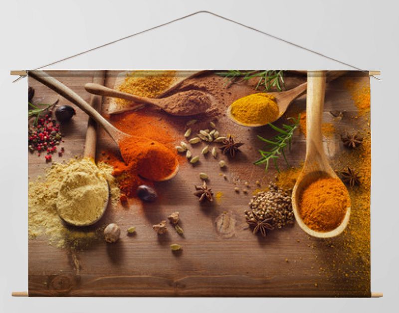 Various spices on wooden board.
