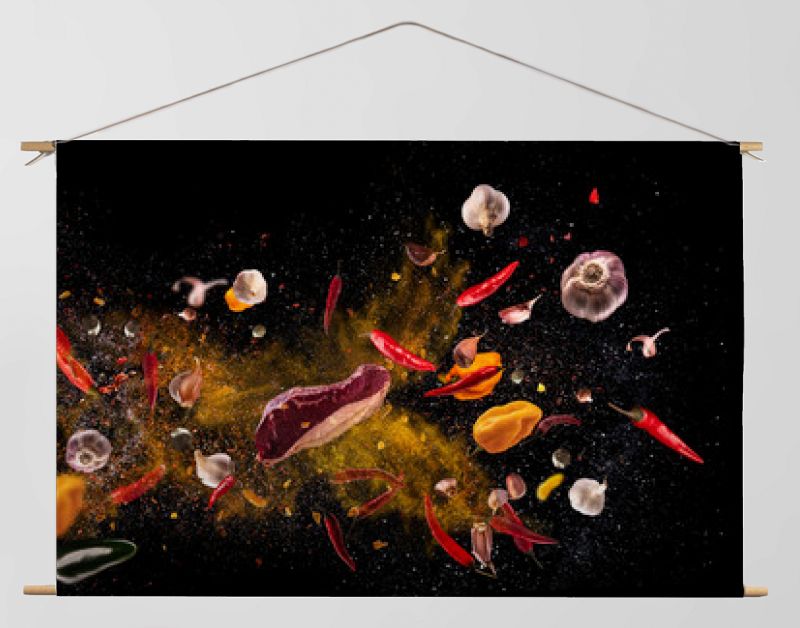 Hot red pepper, garlic, different spices powder meat stakes flying on a black background Motion freeze photo composition