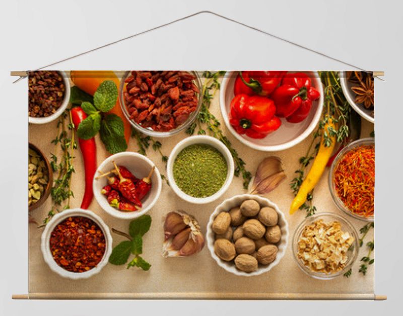 Variety of vibrant spices and dried herbs arranged on a beige backdrop, essential for culinary seasoning and enriching dishes with aromatic, natural flavors, banner