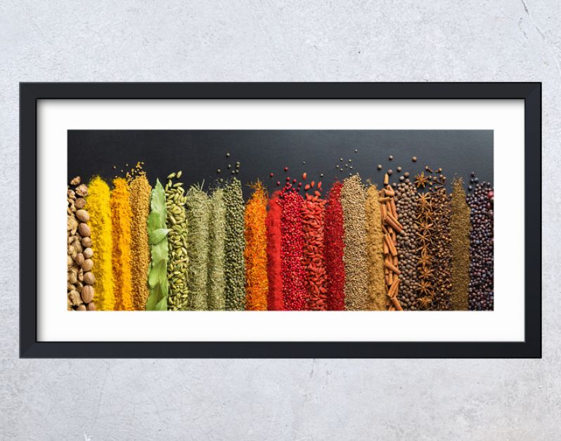 Colorful collection spices and herbs on background black table. Mediterranean condiments for decorating packing with food.