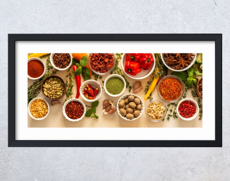 Variety of vibrant spices and dried herbs arranged on a beige backdrop, essential for culinary seasoning and enriching dishes with aromatic, natural flavors, banner
