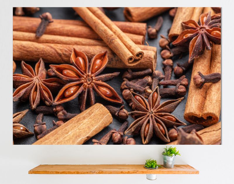 Lots of three spices for mulled wine – star anise, cinnamon and clove, macro.