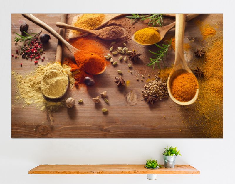 Various spices on wooden board.
