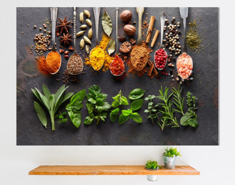 Spices and herbs on black board