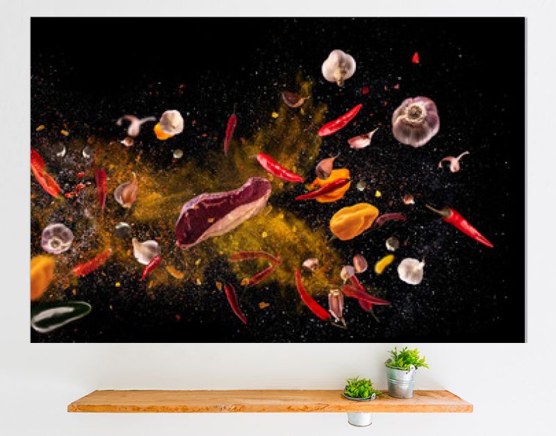Hot red pepper, garlic, different spices powder meat stakes flying on a black background Motion freeze photo composition