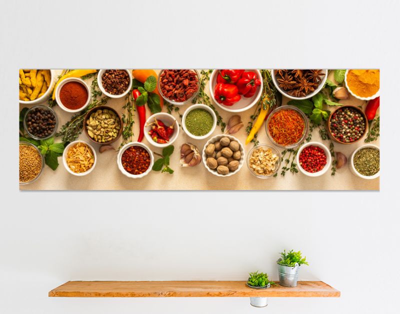 Variety of vibrant spices and dried herbs arranged on a beige backdrop, essential for culinary seasoning and enriching dishes with aromatic, natural flavors, banner