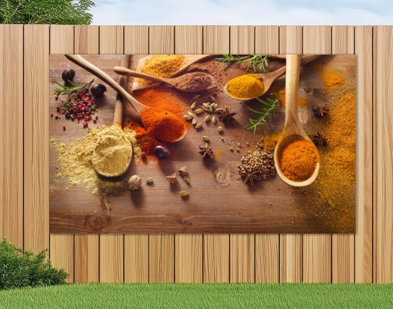 Various spices on wooden board.