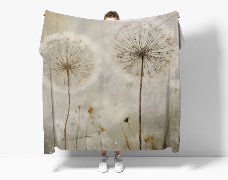 White dandelion blowing in the breeze